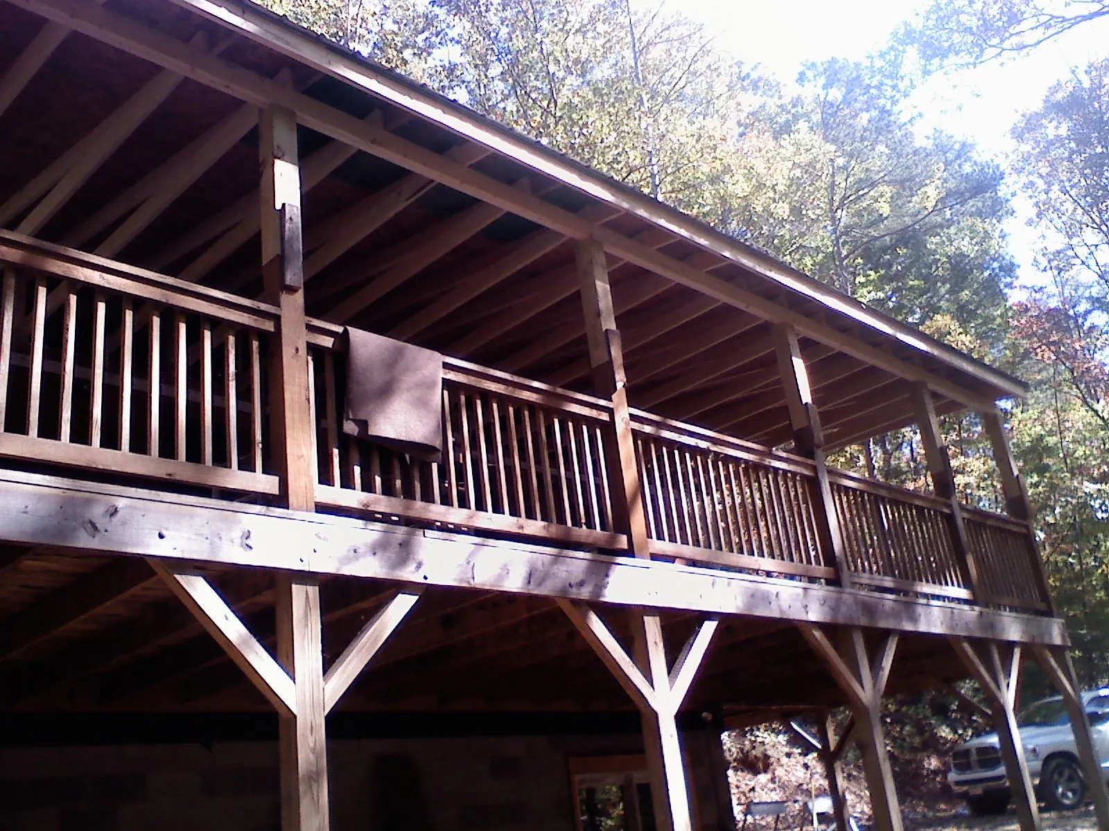 Timber framing under a new elevated porch and deck — Roof Leak Repair in Oklee by Roofing Brothers